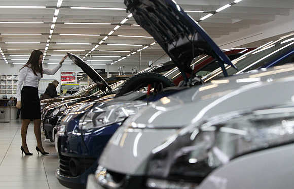 An employee works at a Renault cars sales and showroom in Moscow.