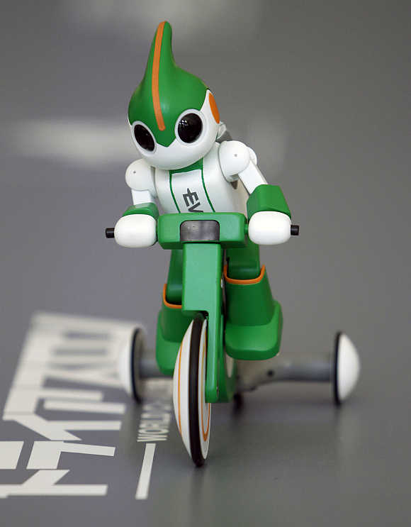 Panasonic's 'Evolta' bike robot, powered by the company's Evolta rechargable batteries, is demonstrated in Tokyo.