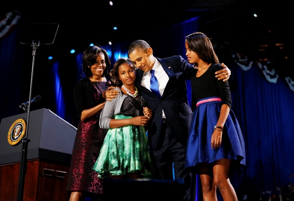 U.S. President Barack Obama celebrates with first lady Michelle Obama and their daughters Malia (R) and Sasha at their election night victory rally in Chicago, November 7, 2012.