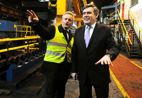 Britain's Prime Minister Gordon Brown speaks with operations manager Andy Wood (L) during his visit to the Corus Steel plant in Corby, central England.