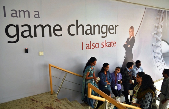 Employees chat with each other during lunch hours at the Indian headquarters of iGate in Bengaluru.