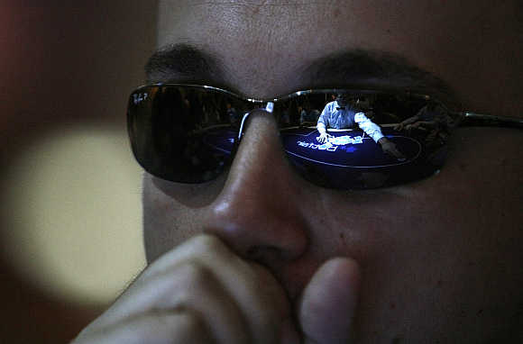 A man reacts during a game at the Betfair Asian Poker Tour in Singapore.