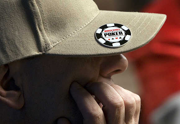 A poker player wears the World Series of Poker logo on his cap at the no-limit Texas Hold 'em main event at the Rio hotel-casino in Las Vegas, Nevada, United States.