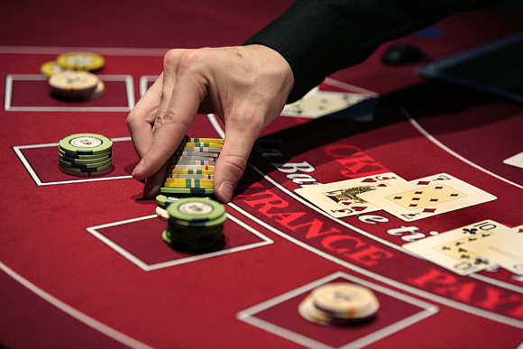 A croupier deals a hand for a poker at the new Casino Barriere in Toulouse, France.