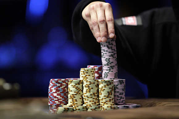 Jonathan Duhamel of Canada stacks chips in the finals of World Series of Poker Main Event at the Rio hotel-casino in Las Vegas, Nevada, United States.