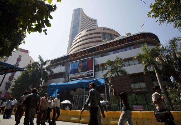 People walk outside the Bombay Stock Exchange building.