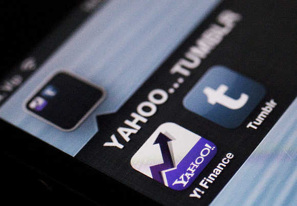 A photo illustration shows the applications of Yahoo and Tumblr on the screen of an iPhone.