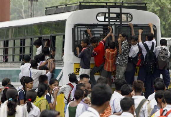 School children travel on an over-crowded bus in New Delhi.