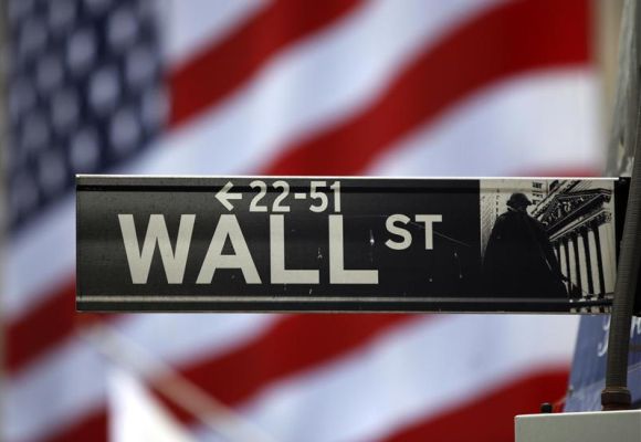 The Wall Street sign is seen outside the New York Stock Exchange.