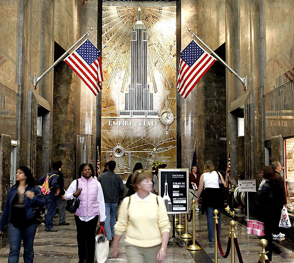 People walk through the lobby of the Empire State Building on its 75th birthday May 1, 2006 in New York City.