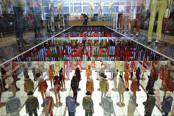 A woman browses in Fast Retailing's Uniqlo casual clothing store in Tokyo.