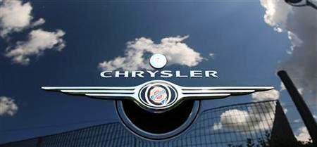 Clouds are reflected on a Chrysler PT Cruiser at a Chrysler dealership in Rome.
