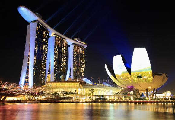 Singapore's The Marina Bay Sands hotel, left, and ArtScience Museum, right.
