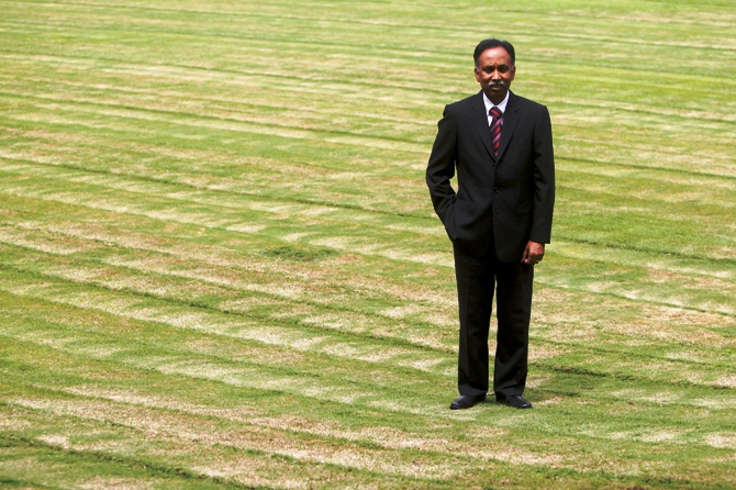 S D Shibulal poses for a picture on a lawn inside Infosys campus in Bengaluru.