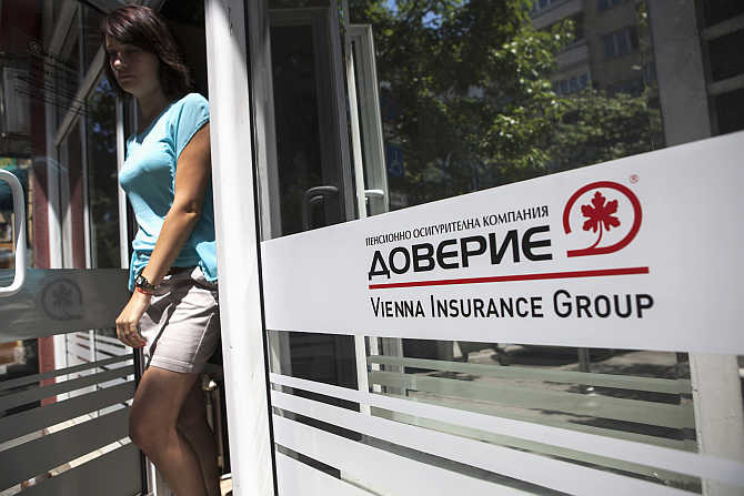 An employee walks out of an office of Doverie, the country's biggest private pension fund, in Sofia, Bulgaria.
