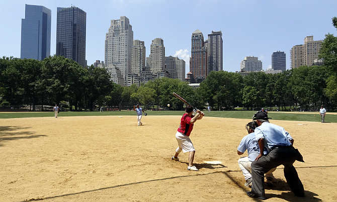 A game of baseball is on in Central Park in New York City, United States.