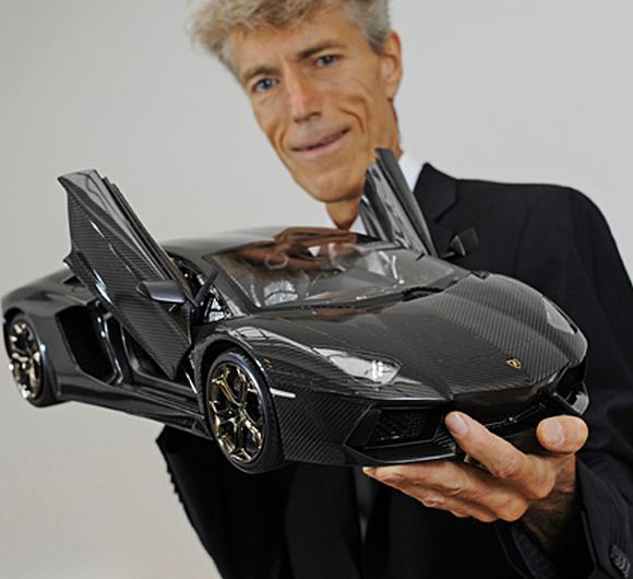 Robert Gulpen holding the prototype of Lamborghini Aventador.