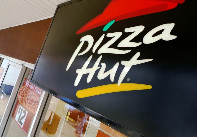 A Pizza Hut logo is pictured outside its restaurant in Vienna.