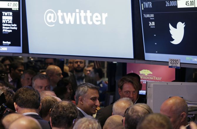 Twitter CFO MIke Gupta (C) is shown during the Twitter Inc. IPO on the floor of the New York Stock Exchange.