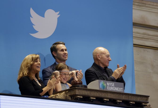 Actor Patrick Stewart (R) and 9-year-old Vivenne Harr (C), who uses proceeds from her lemonade stand to fight slavery, ring the opening bell as NYSE Executive Vice President and Head of Global Listings Scott Cutlerand and Boston police officer Cheryl Fiandaca (L) look on during the Twitter Inc. IPO on the floor of the New York Stock Exchange.