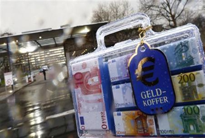 A money suitcase (Geldkoffer) containing chocolate euro notes is pictured outside the headquarters of Germany's federal bank Deutsche Bundesbank.