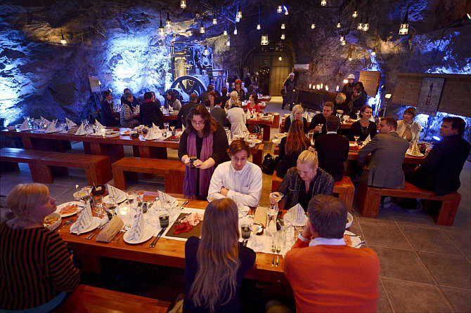 Customers eat their dinner at Muru Pop Down restaurant at Tytyri mine in Lohja, Finland.