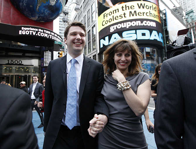 Groupon Chief Executive Andrew Mason with his wife, pop musician Jenny Gillespie, outside the Nasdaq Market following his company's IPO in New York.