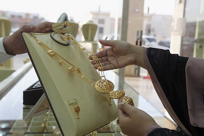 A woman looks at jewellery in the gold market in Riyadh, Saudi Arabia.