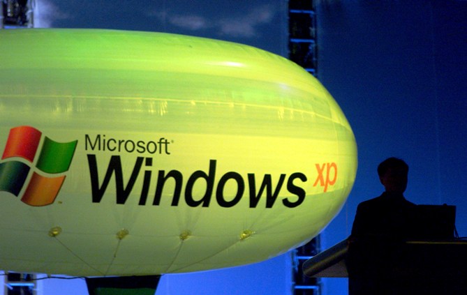 This file photograph shows a Microsoft engineer introducing the new Chinese Windows XP during the launch of the operating system in Beijing.
