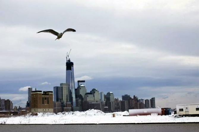 Skyline of New York's Lower Manhattan and One World Trade Center after the passing of a winter storm in Newport in New Jersey