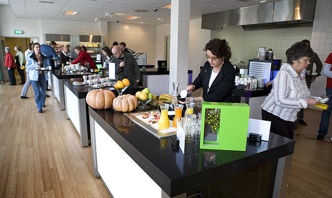 Customers pick their food in the 'restaurant of the future' at the Dutch University of Wageningen, eastern Netherlands. The university has opened a 'big brother' restaurant where academics and companies can study consumer behaviour by tracking diners on cameras to test their reactions to food products, packaging and restaurant design.