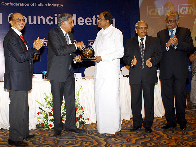 Finance Minister P Chidambaram honoured Ratan Tata with CII's President Award.