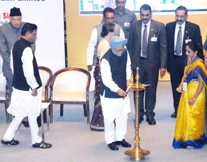 Prime Minister Dr Manmohan Singh lighting the lamp at the inaugural function of the Bharatiya Mahila Bank in Mumbai on Tuesday.