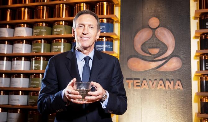 Howard Schultz, chief executive of Starbucks, holds a cup of tea.