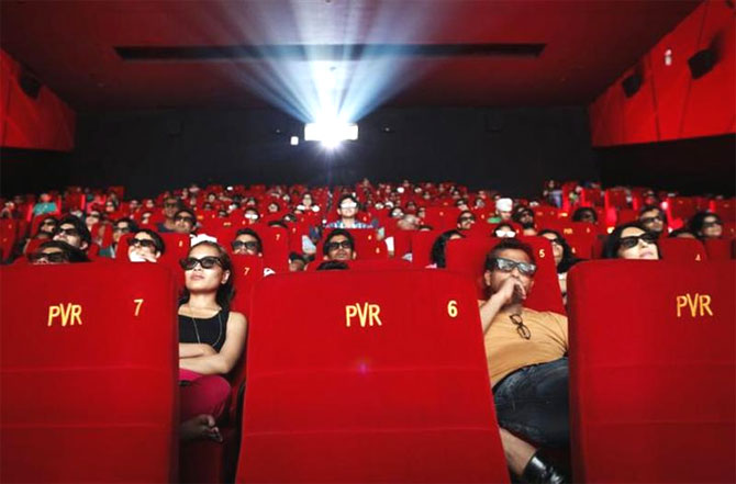 Cinema-goers wearing 3D glasses watch a movie at a PVR Multiplex in Mumbai.