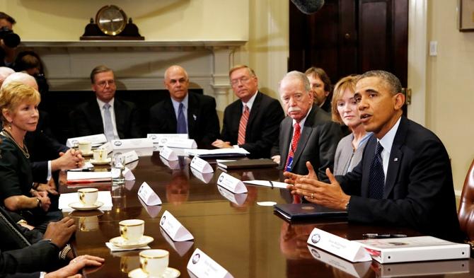 US President Barack Obama meets with health insurance chief executives at the White House in Washington November 15, 2013.