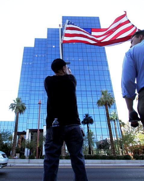 A man waves the US flag.