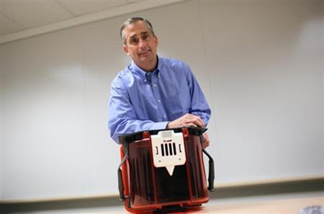 Brian Krzanich poses with a Front Opening Unified Pod at Intel headquarters in Santa Clara, California.