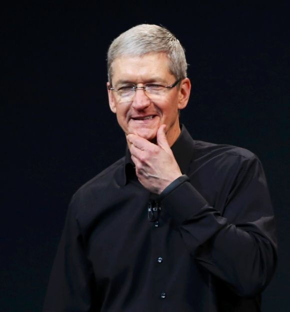 Apple Inc CEO Tim Cook speaks on stage during an Apple event.