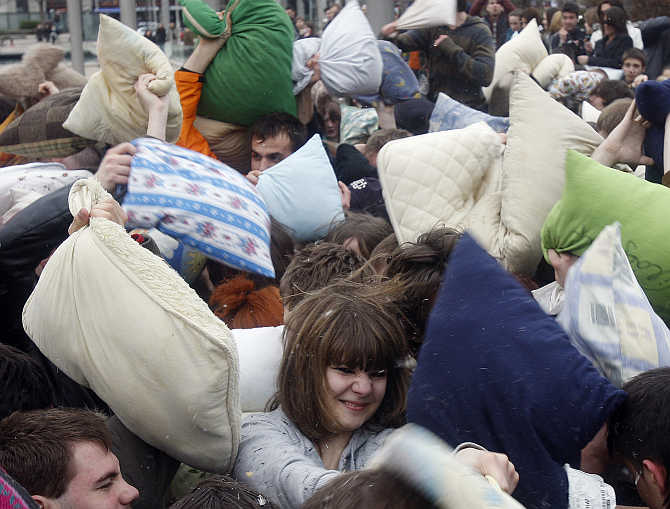 People fight during the International Pillow Fighting Day in Budapest, Hungary.