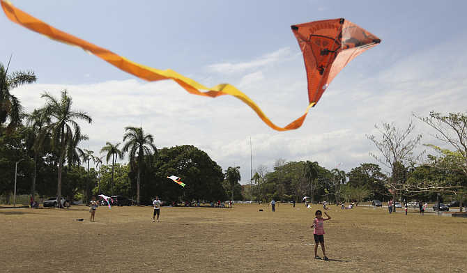 A girl flies her kite in Panama City, Panama.