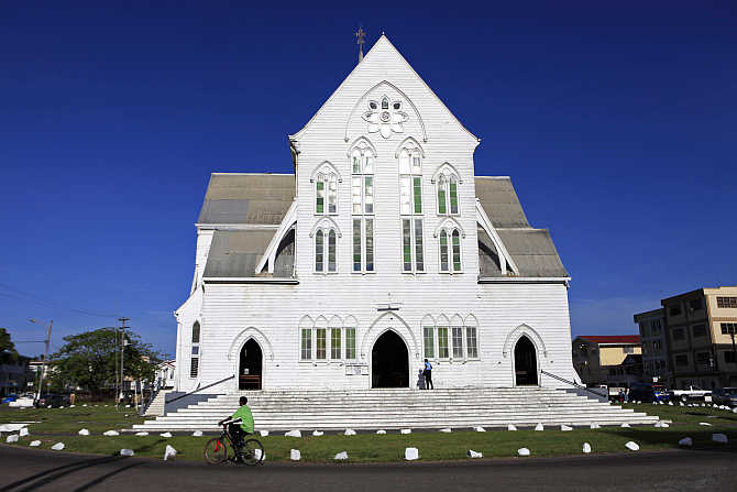 A woman enters St George's Anglican Cathedral in Georgetown, Guyana.