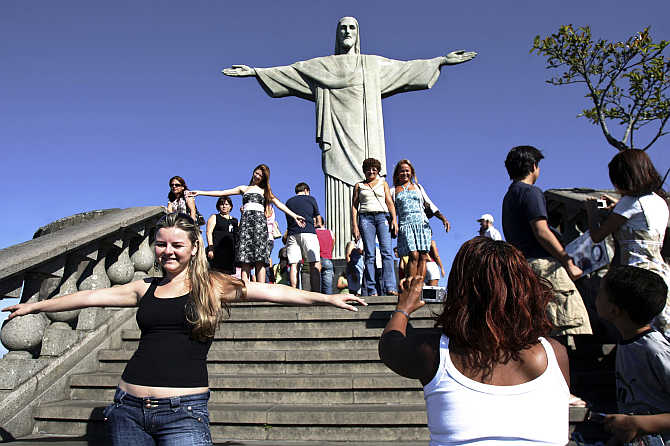 Tourists visit the Christ the Redeemer statue in Rio de Janeiro, Brazil.