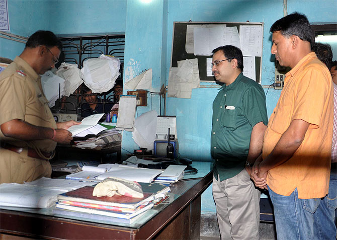 Kunal Ghosh, far left, at the Bidhannagar South police station on Friday, November 22, 2013.