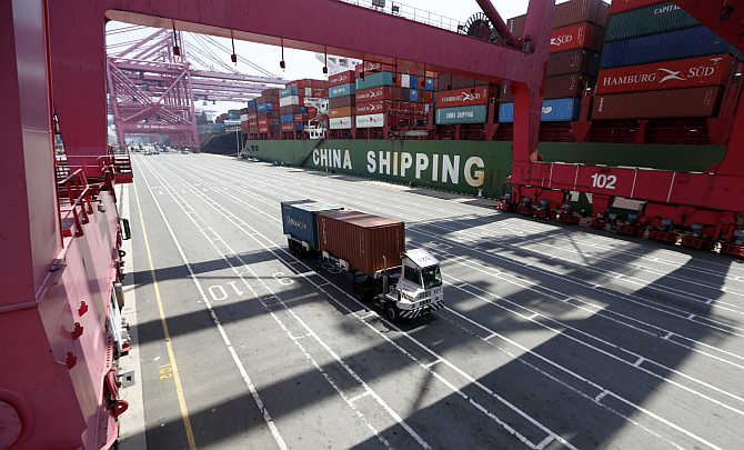 A truck transports containers in Busan, about 420km southeast of Seoul, South Korea.