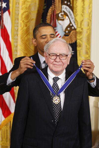 US President Barack Obama awards the Medal of Freedom to recipient Warren Buffett during a ceremony to present the awards at the White House in Washington.