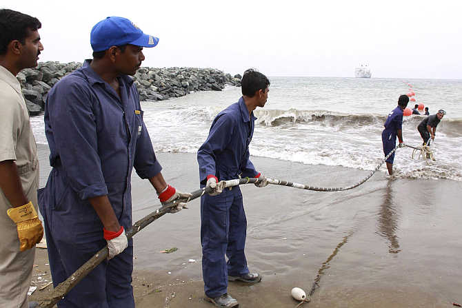 Alcatel-Lucent contractors lay the East African Marine Cable fibre optic cable on the Fujairah shore-end, United Arab Emirates.