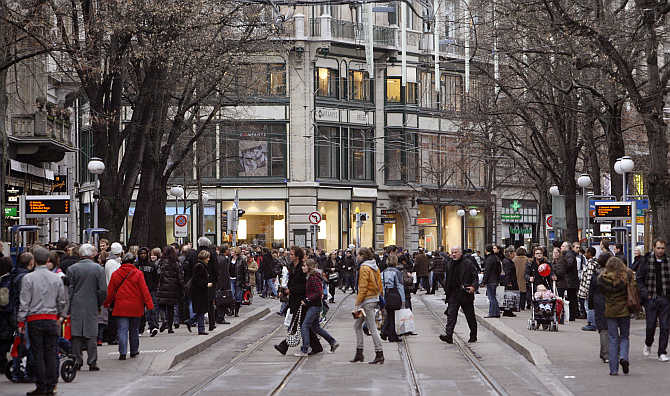 People walk on Zurich's main shopping street Bahnhofstrasse, Switzerland.