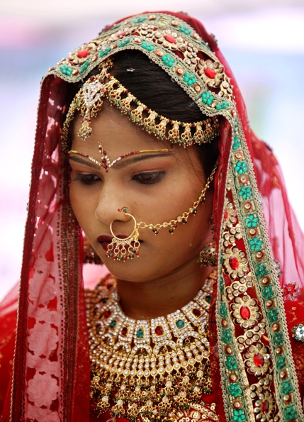 A bejewelled bride attends a mass marriage ceremony in Ahmedabad.