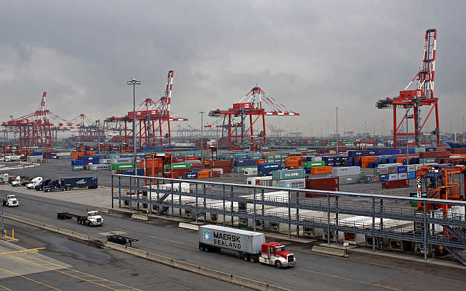 Trucks pass the Port Newark Container Terminal near New York City in Newark, New Jersey.